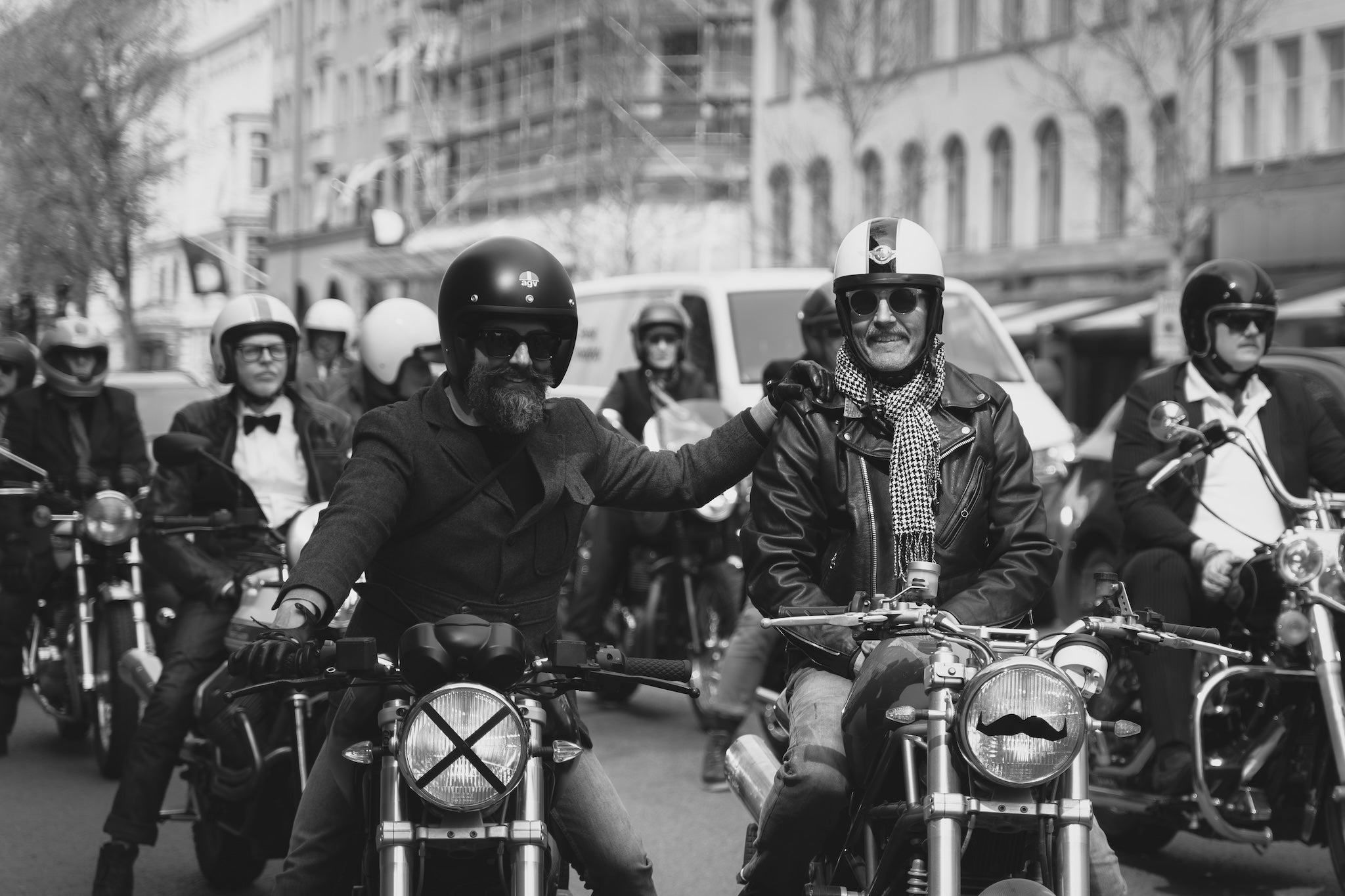 Two smiling men on vintage motorcycles participating in Gentlemans Ride in Stockholm 2025.