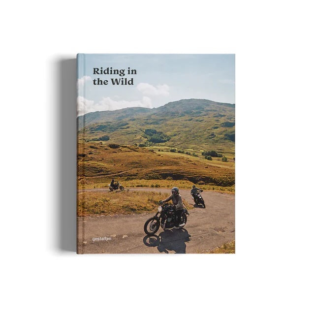 Book cover with three motorcyclists riding a winding dirt road against a mountain back drop.