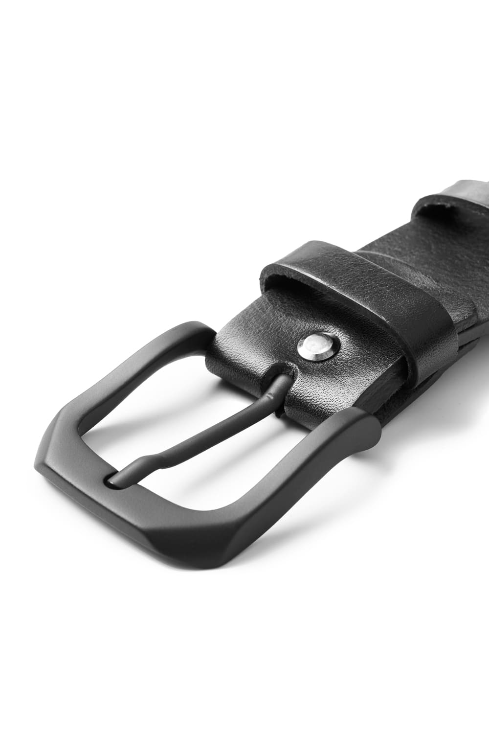 Close-up on a black belt buckle on a black leather belt.